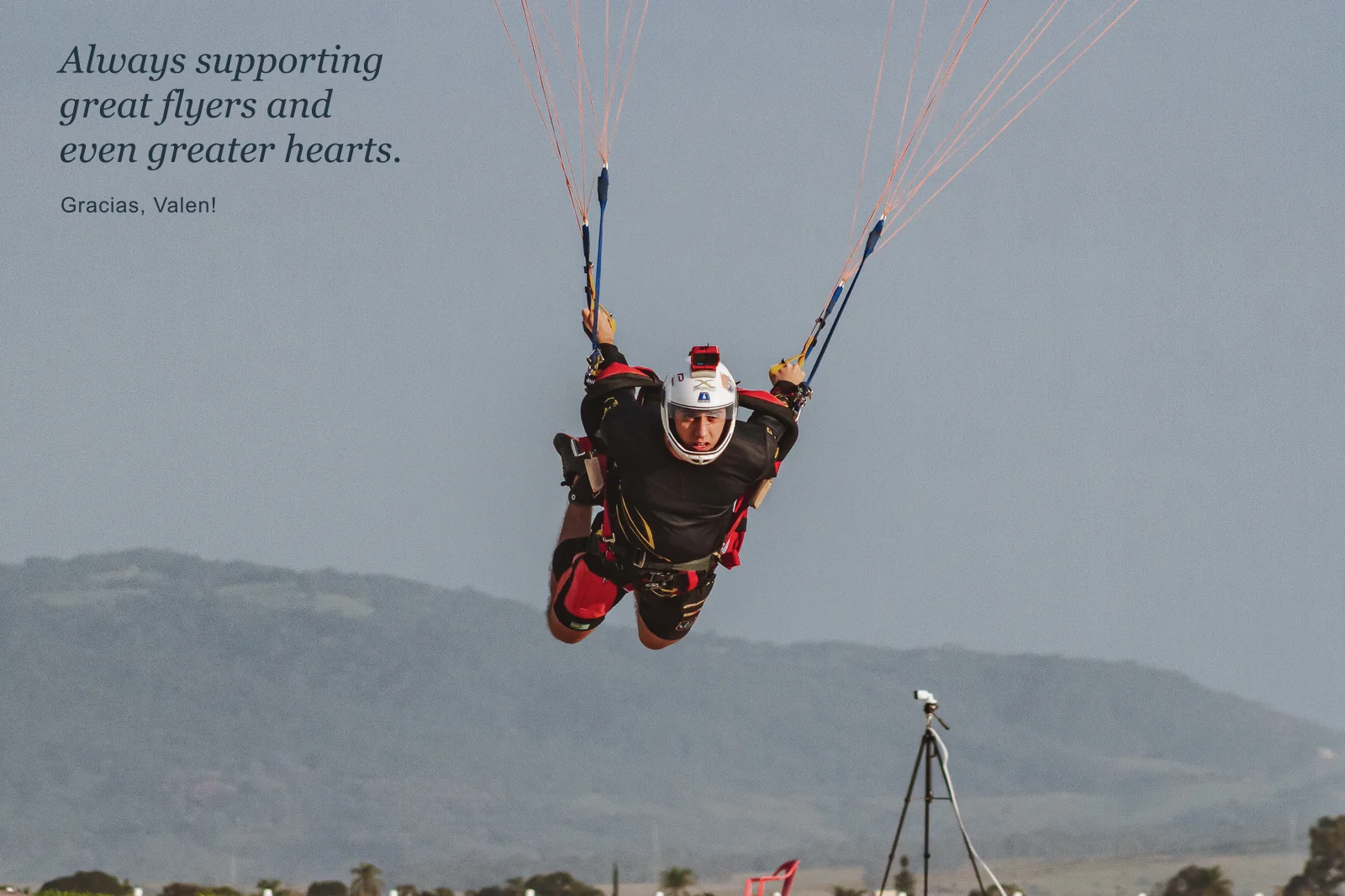 Valen flying under an open parachute. Always supporting great flyers and even greater hearts. Gracias, Valen!